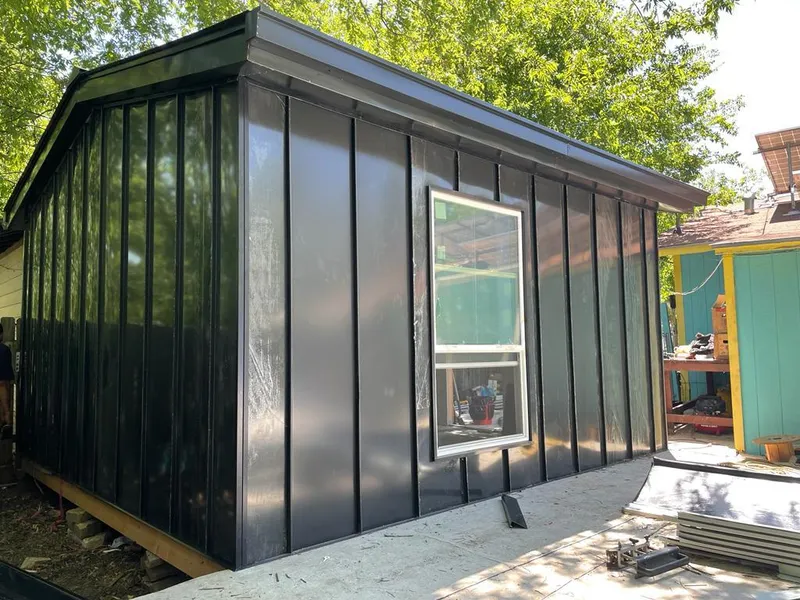 Black standing seam metal wall panels for Metal Roof Installation in Williamsville