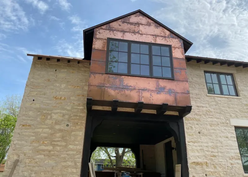 Copper metal panel facade on a stone building for Skylight Installation in Williamsville